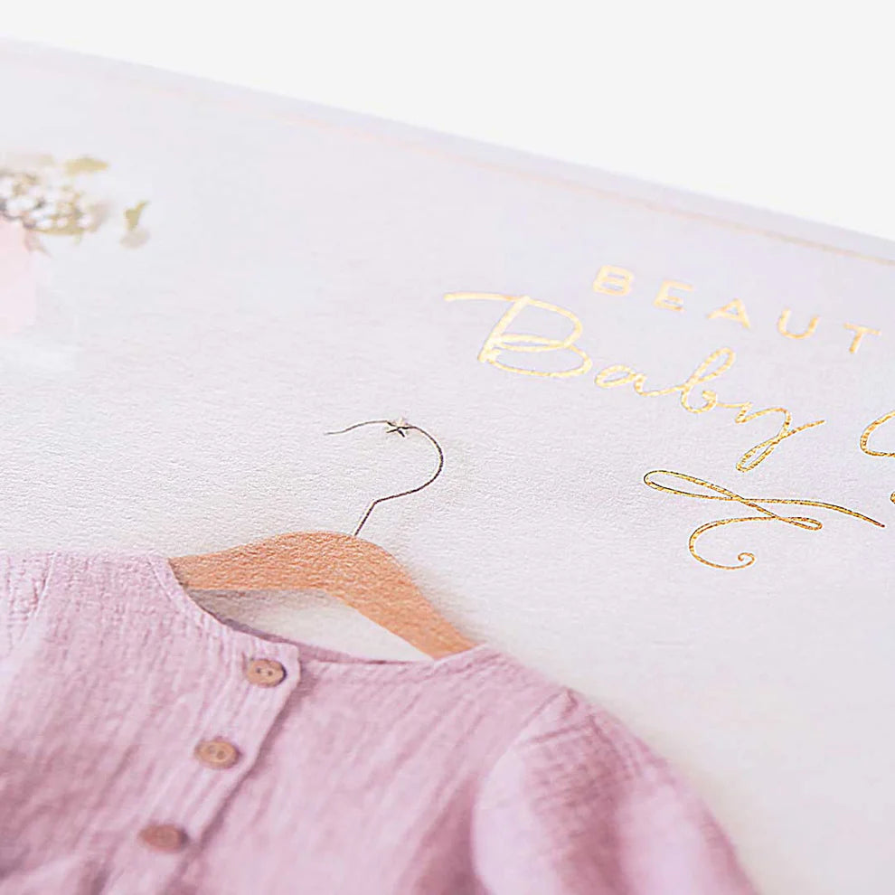 Adorable greeting card designed to welcome a newborn baby girl with soft pastel colors and sweet details.