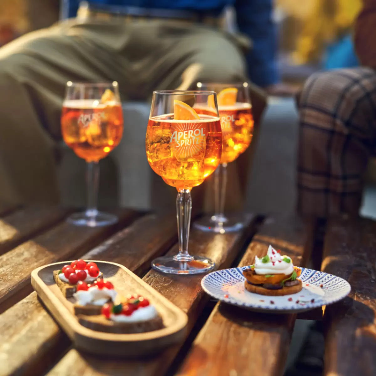 Aperol Aperitivo, 1L bottle displayed on a bar counter, ideal for social occasions.