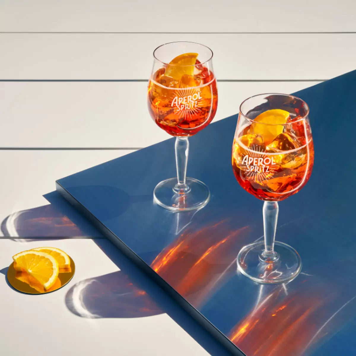 Aperol Aperitivo, 1L bottle paired with a refreshing Aperol Spritz cocktail.
