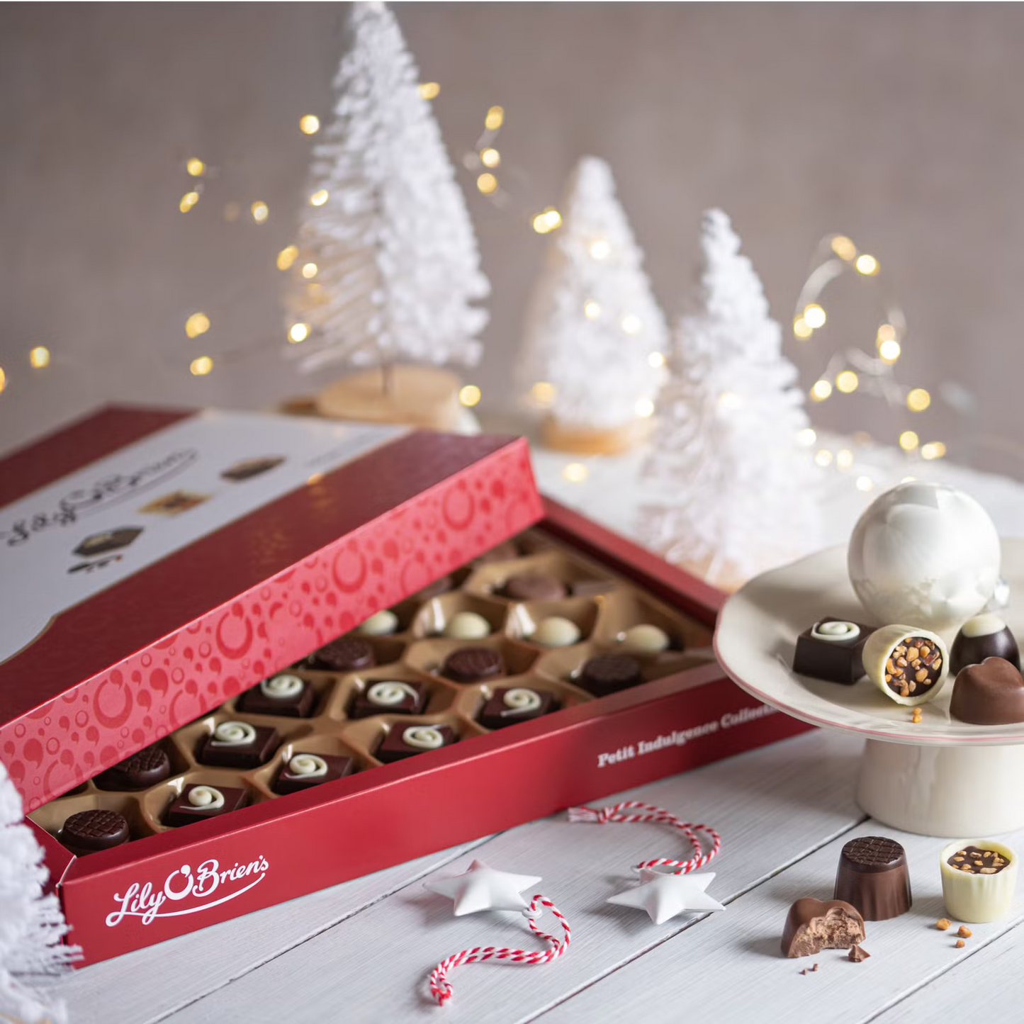 Bite-sized gourmet chocolates including Le Crunch Chocolat, Praline Perfection, and Raspberry Cream