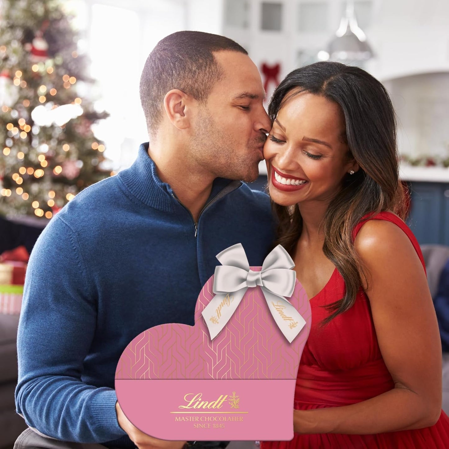 Luxury two-pack chocolate truffle gift boxes with decorative pink ribbon
