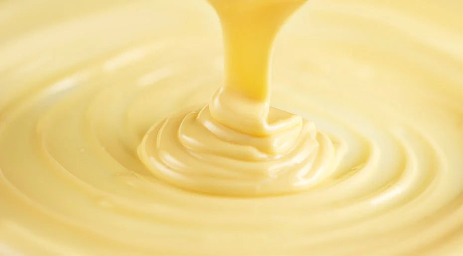20kg Moo Free white chocolate couverture block with new recipe label