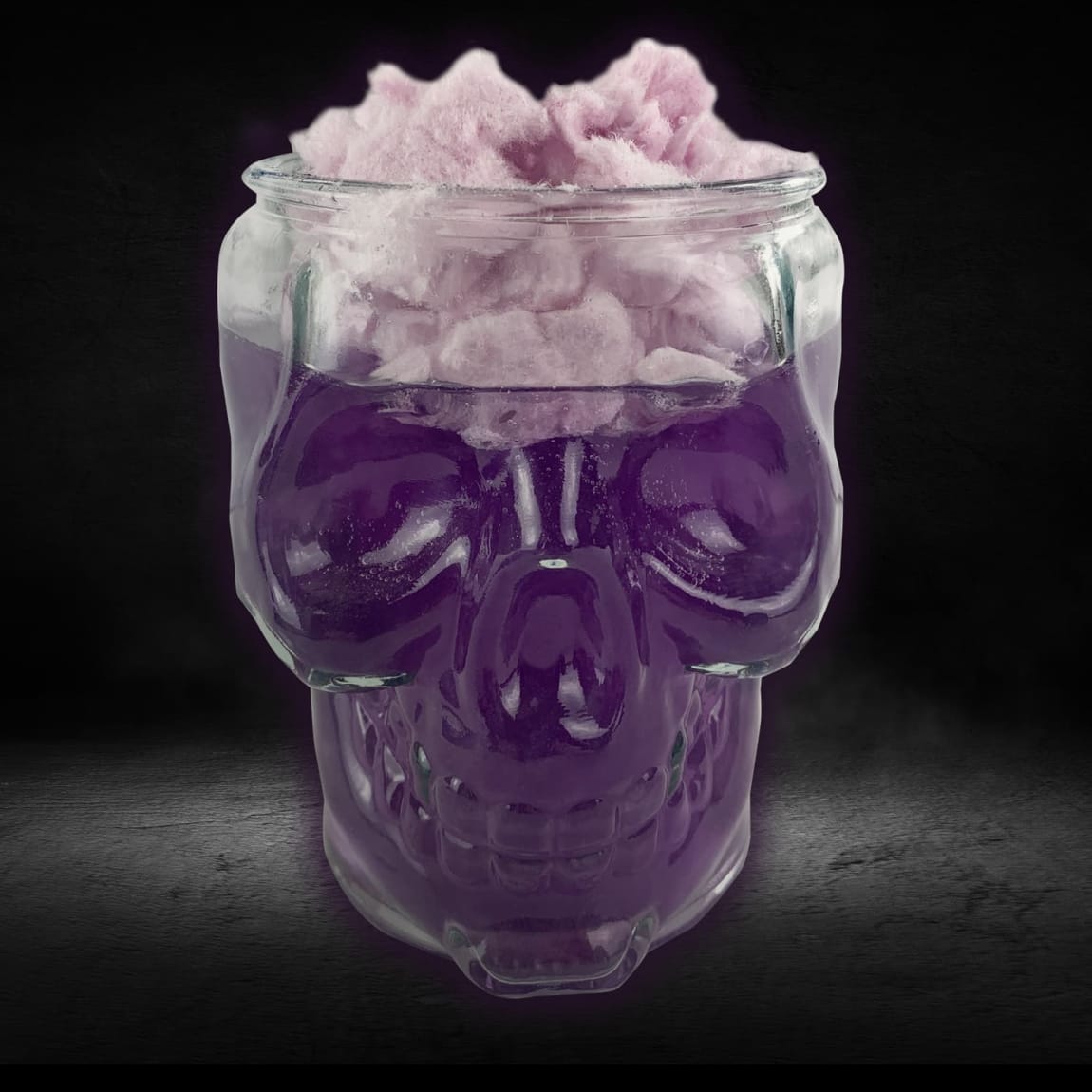 Skull-shaped mason jar with shimmer dust and candy floss included