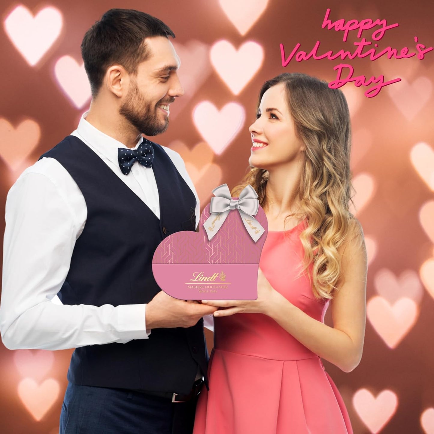 Heart-shaped chocolate truffle boxes wrapped with elegant pink ribbon