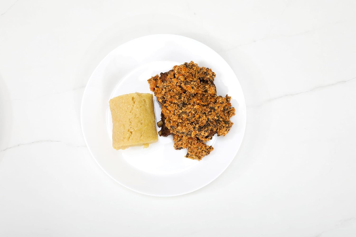 Medium hot egusi soup served with fufu or rice