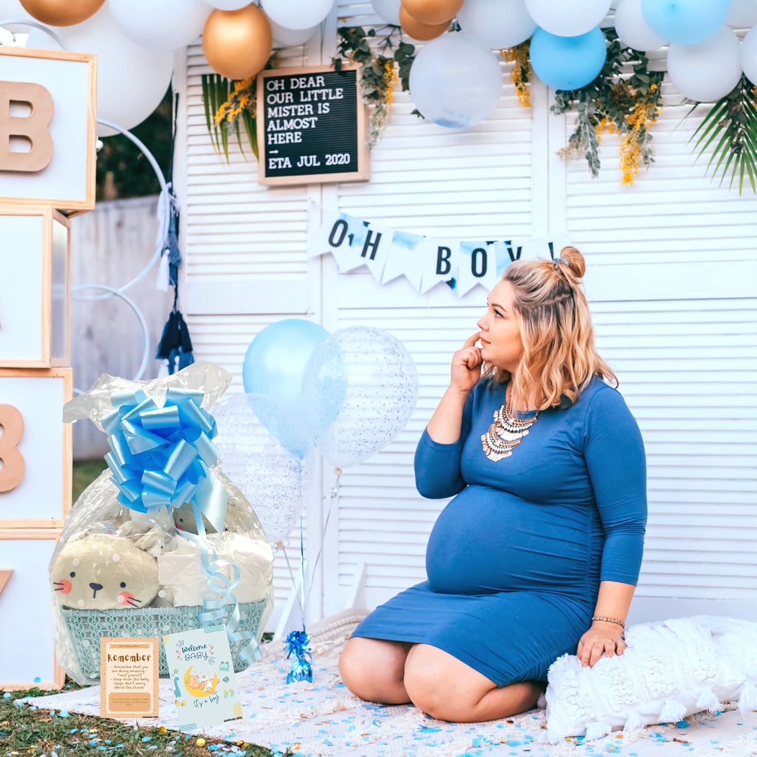 Baby boy basket with nappies and cute accessories