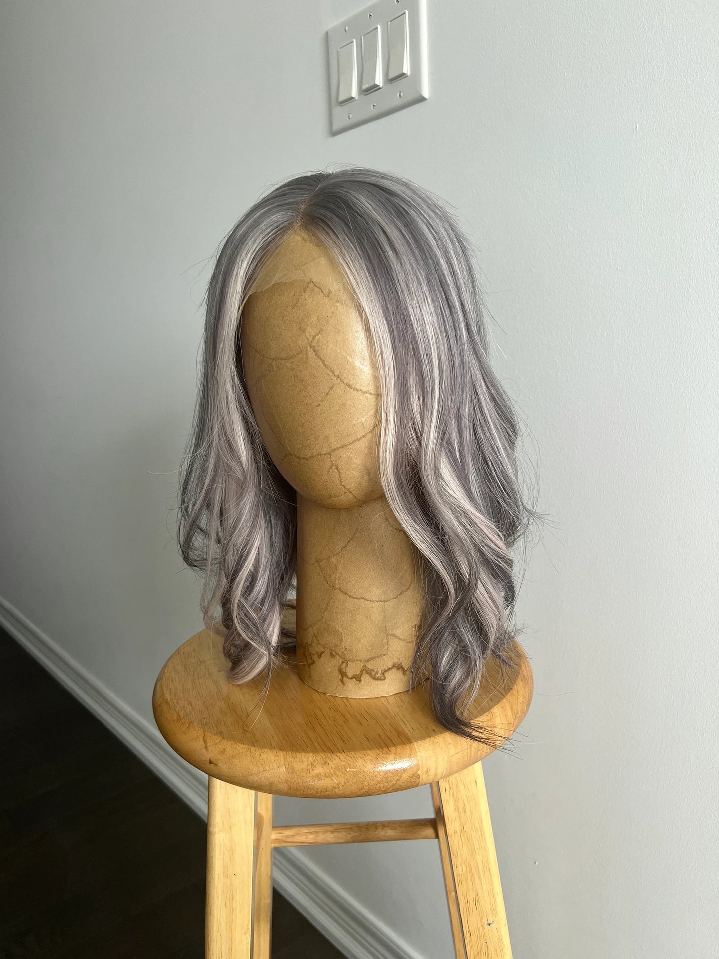 Side angle of 12 inch silver and medium grey HD lace wig
