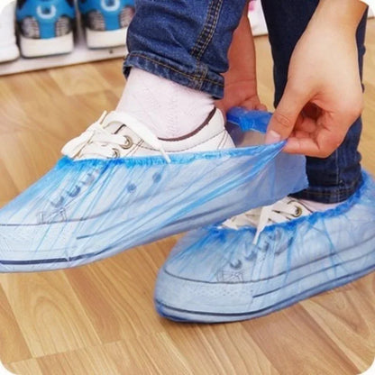 100 piece pack of disposable plastic shoe covers