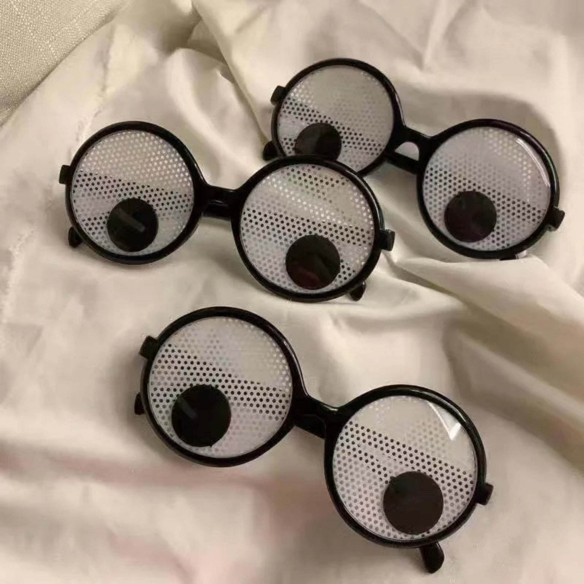 Funny glasses eyeball rolling close up detail plastic metal frame