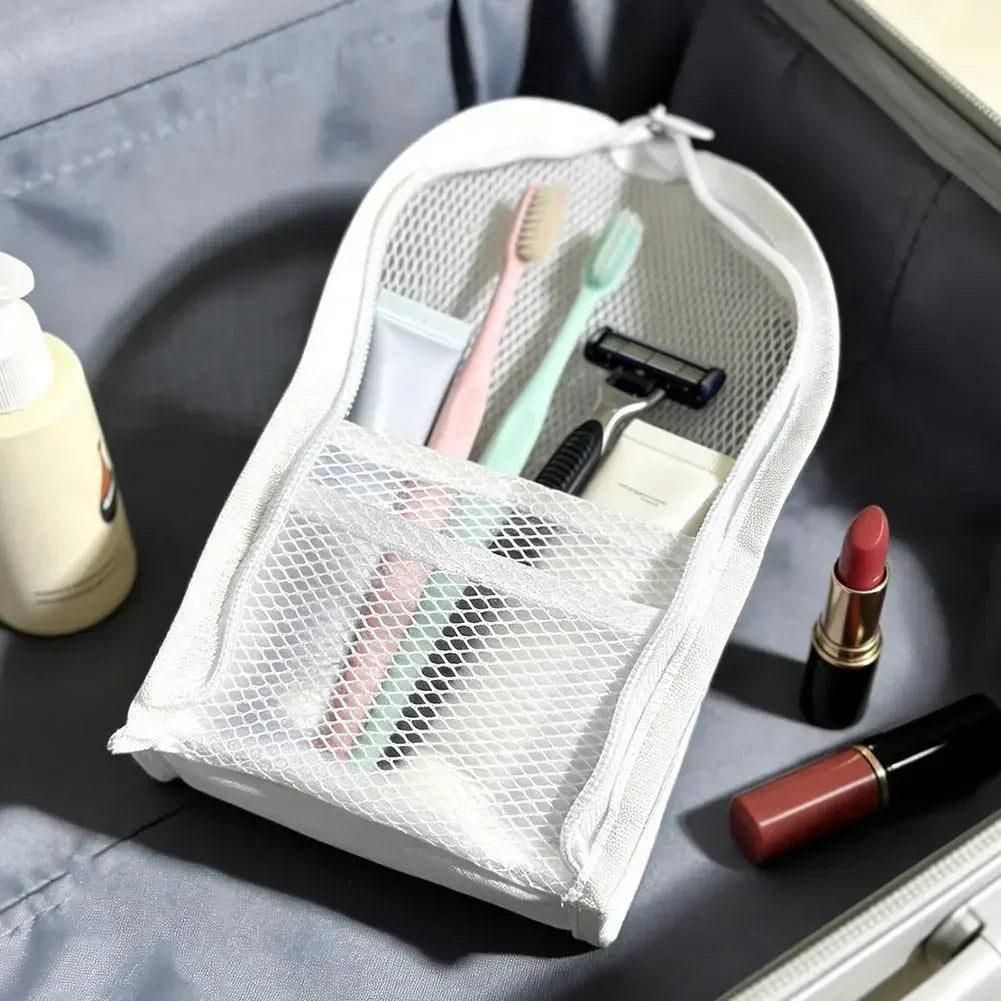 Grey travel toiletry storage bag with standing mesh design