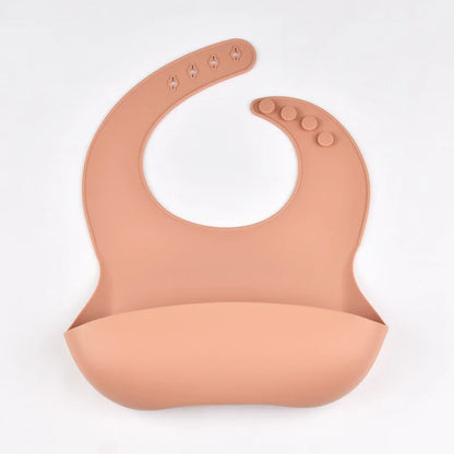 Baby dining bib with food catcher pocket design