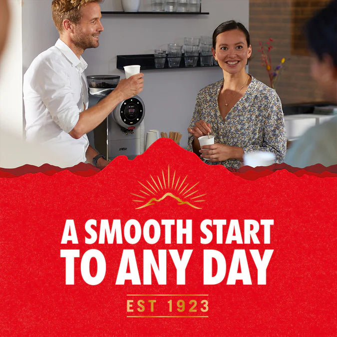 Kenco Smooth Roast Instant Coffee powder in a spoon.