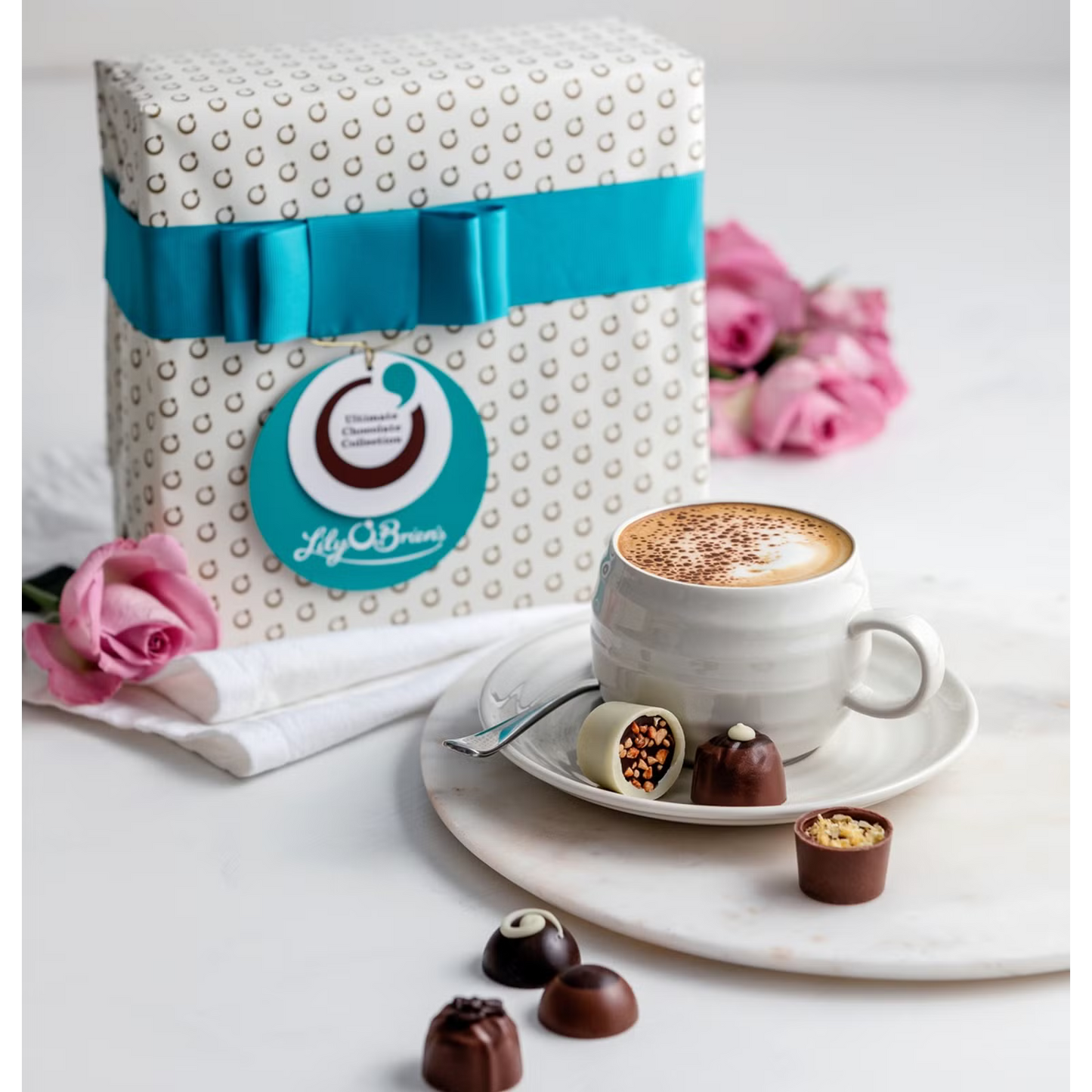 Premium milk, dark, and white chocolates from Lily O’Brien’s in a luxury turquoise gift box