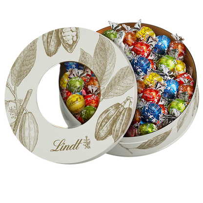 Assorted Lindt white chocolates in cocoa pod shaped tin 450g