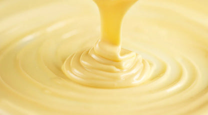 20kg Moo Free white chocolate couverture block with new recipe label