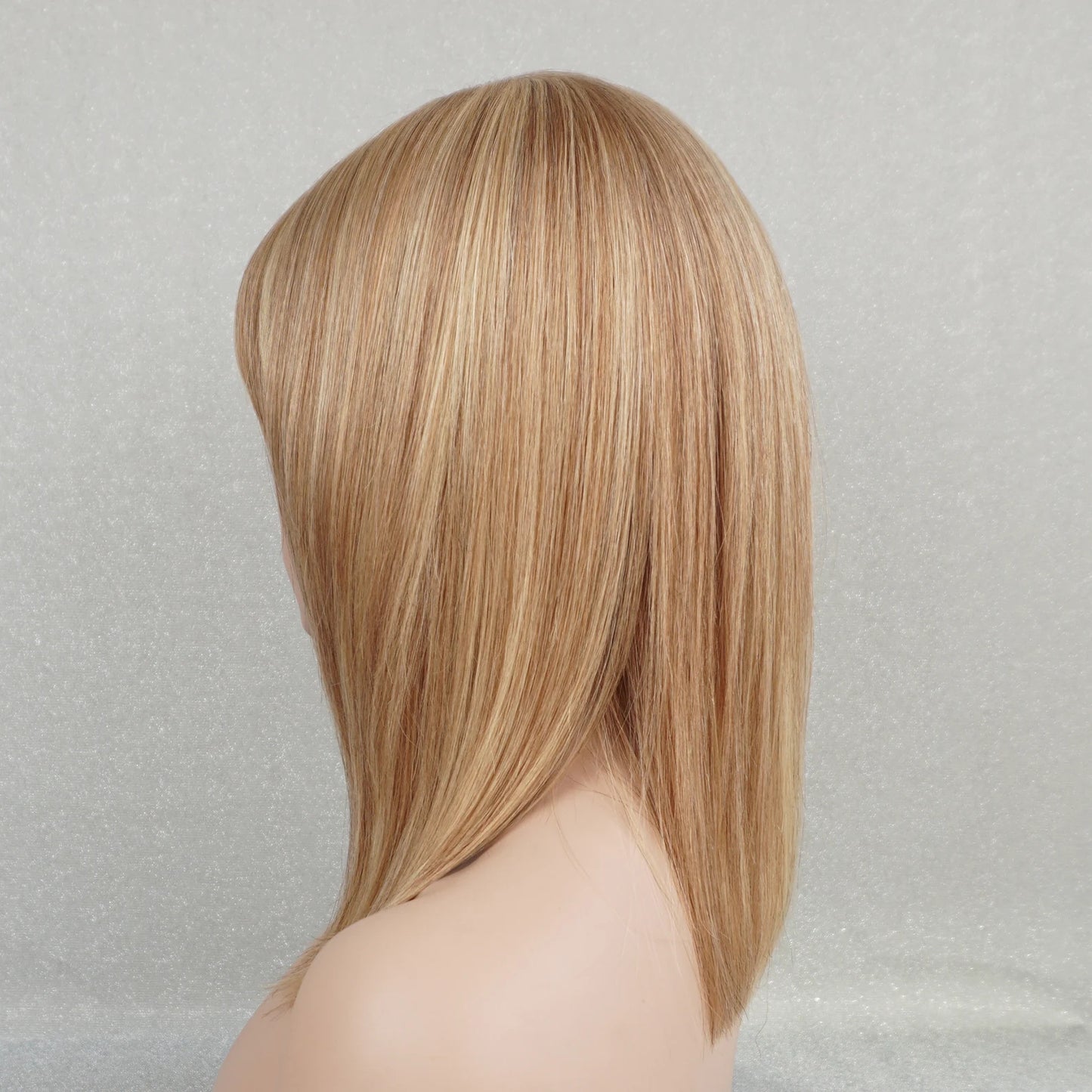 Face-framing bangs on medium-length highlighted wig