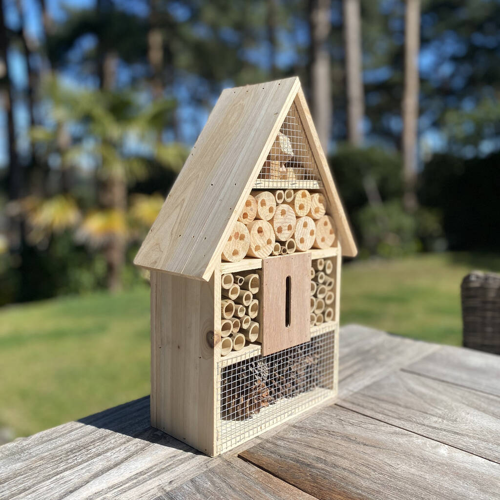 Hanging or freestanding wooden habitat for pollinators and pest control