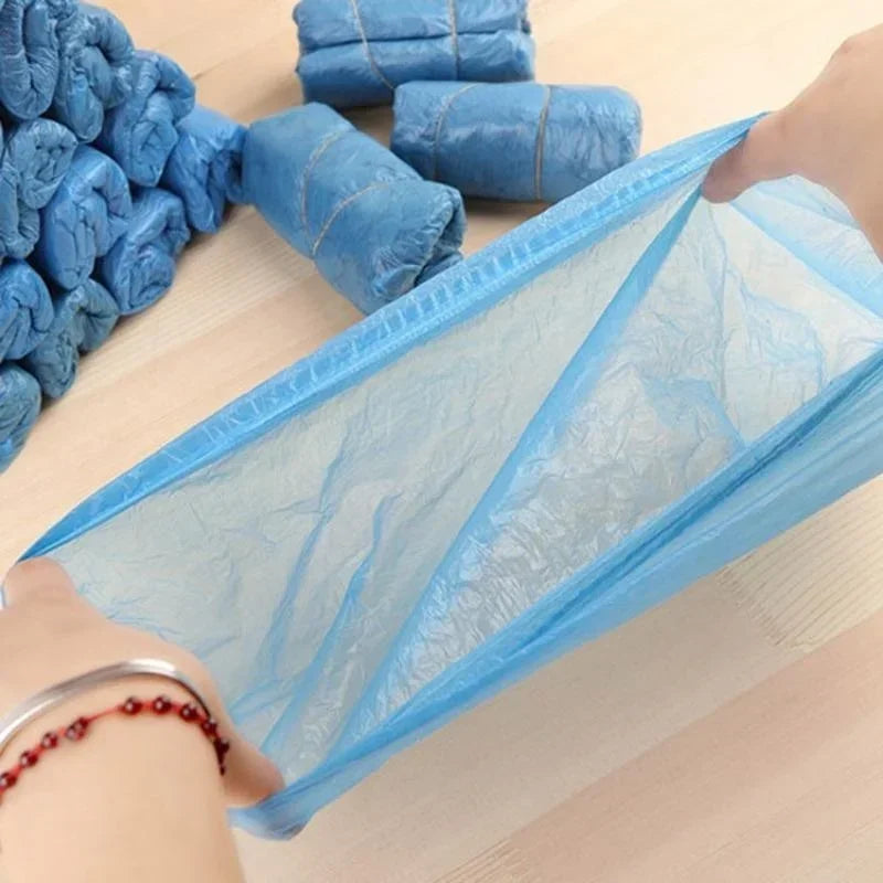Blue plastic shoe covers for household cleaning