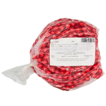 Solid milk chocolate balls wrapped in royal red foil