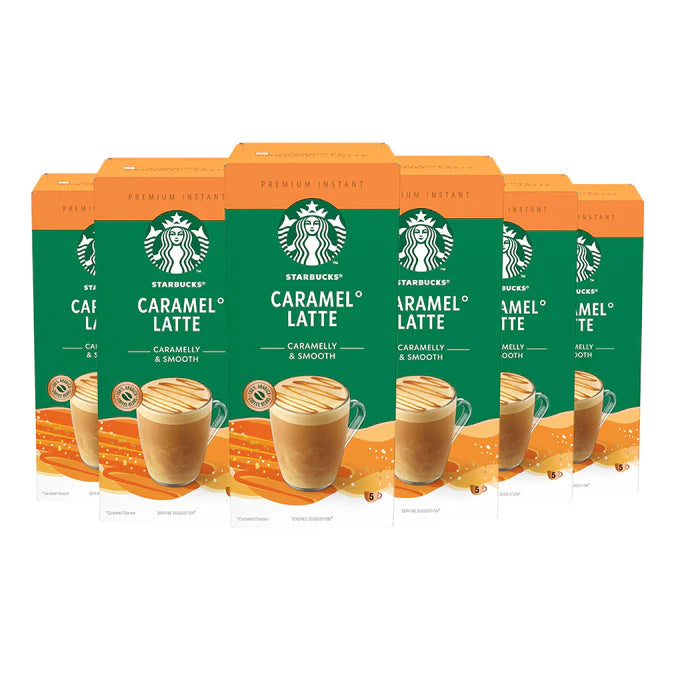 A freshly made Starbucks Caramel Latte from an instant sachet, topped with rich, creamy foam in a white mug