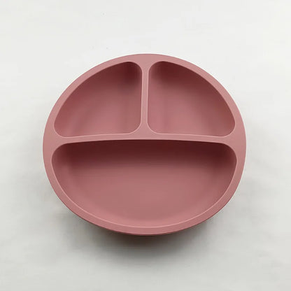 Suction base toddler bowl designed to reduce spills