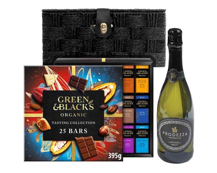 Chocolate tasting collection alongside Prosecco bottle