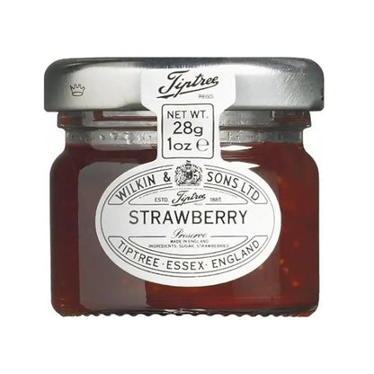 Fresh strawberry preserve in individual mini glass jars