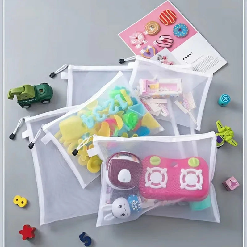 Compact mesh toy storage bags for travel and home