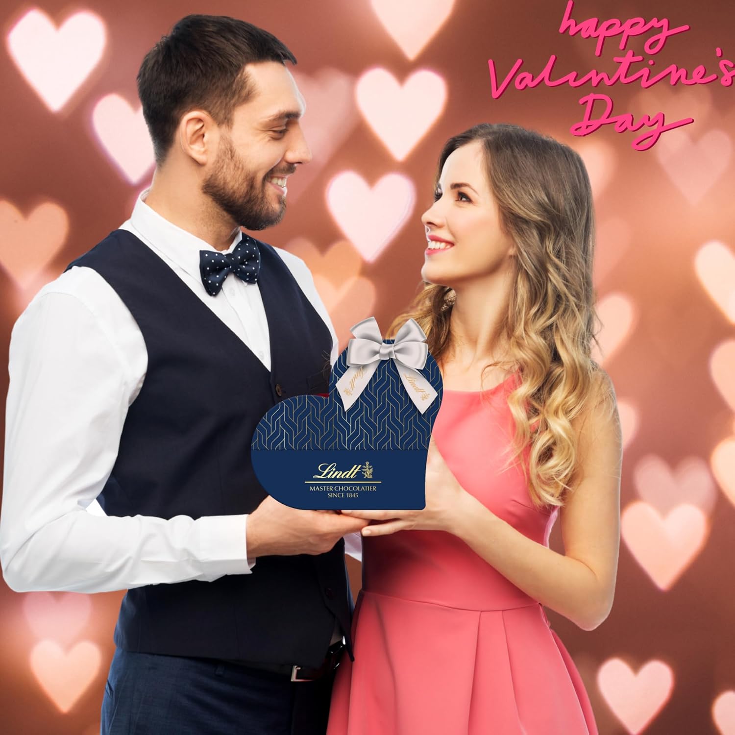 Valentine’s Day Lindt truffles heart box with blue ribbon and cards