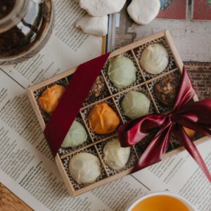 Box of Pralines and Tea on the Table