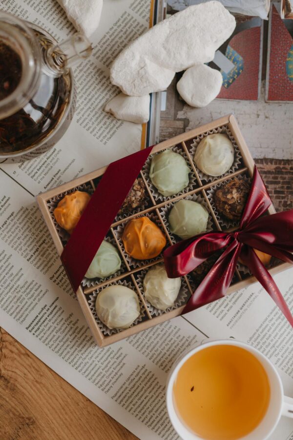 Box of Pralines and Tea on the Table