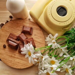 Chocolate with flowers and instant camera